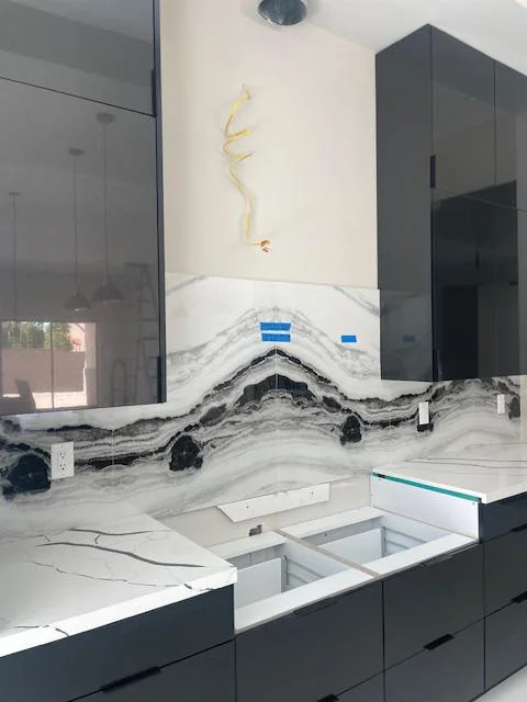 Modern Concepts Design bathroom display with stone surfaces and cabinetry