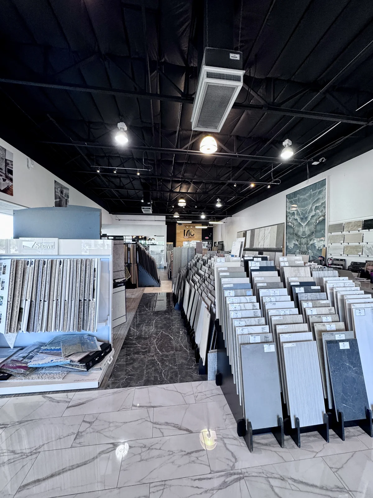 Modern Concepts Design showroom with flooring, cabinet and countertop displays